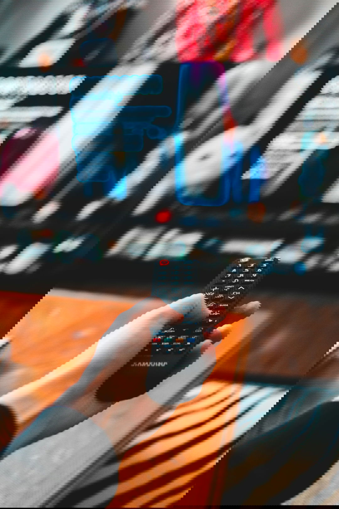 person holding black remote control